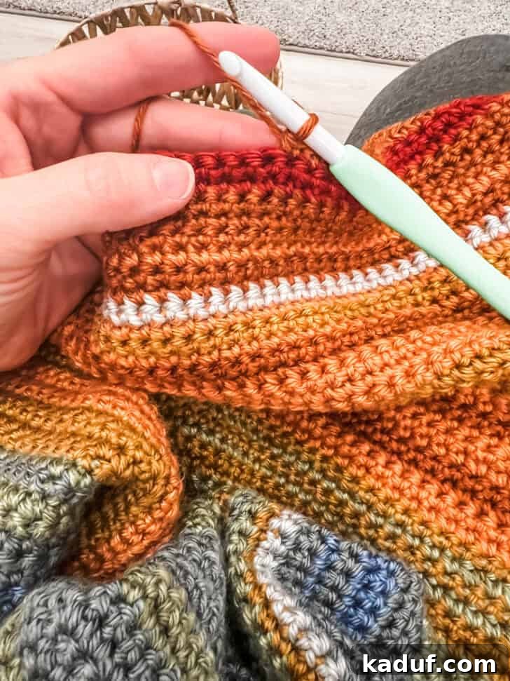Friday Thoughts: A Brain Dump 15 A vibrant, multi-colored temperature blanket, showcasing a beautiful array of yarn representing daily temperatures.