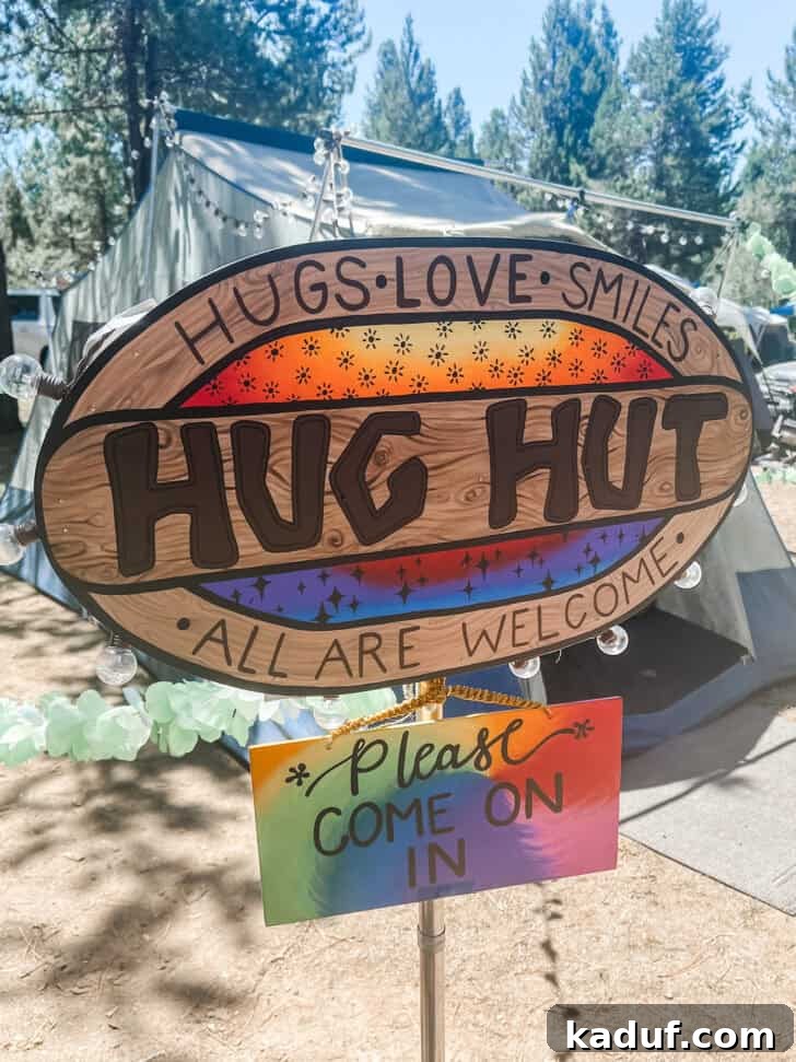 Friday Thoughts: A Brain Dump 5 A charming 'Hug Hut' sign welcoming visitors, set up at a church camp for girls to foster connection and warmth.