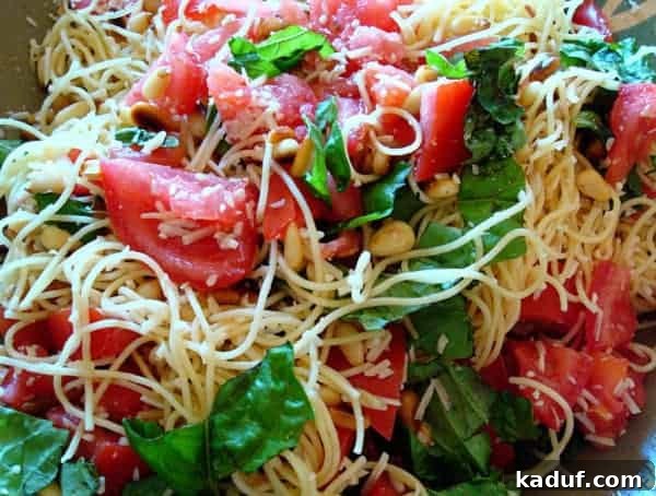 Light & Lively Pasta Salad 2 Spaghetti noodles with spinach and tomato.