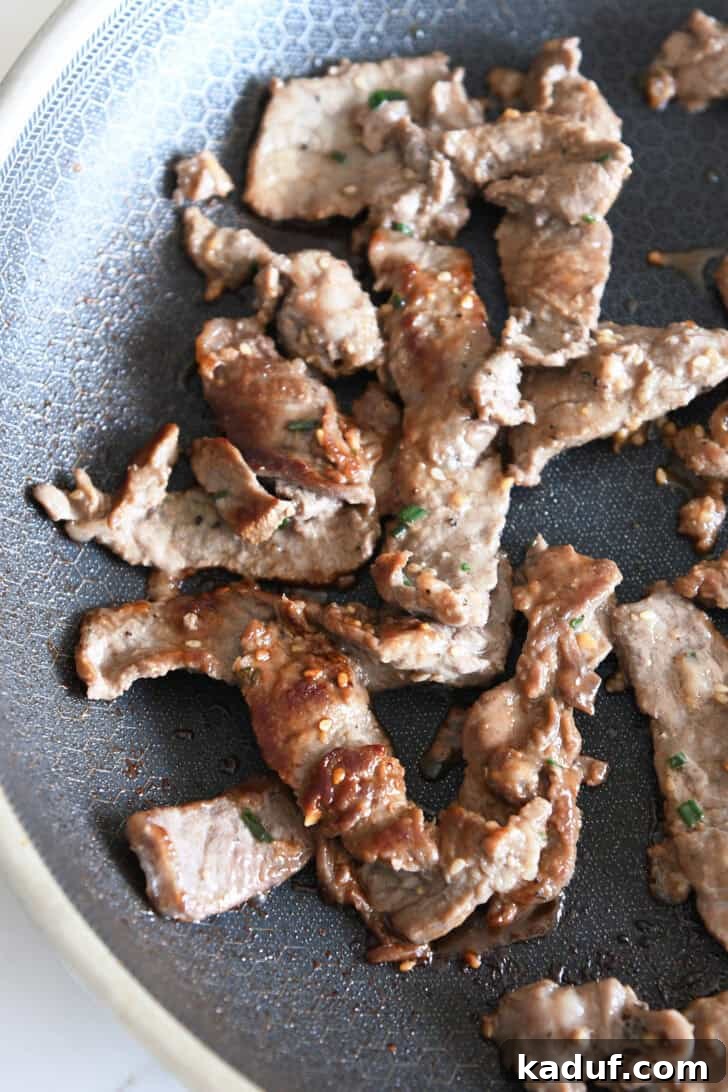 Simple Korean Beef Bulgogi 6 Pan seared pieces of beef in nonstick skillet.