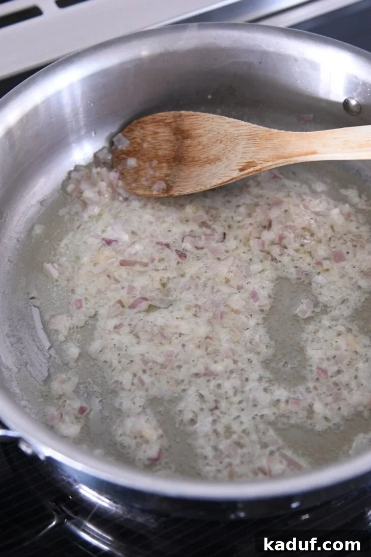 Simple Green Beans Almondine 4 Sauteeing finely diced shallots and garlic in melted butter in a skillet.