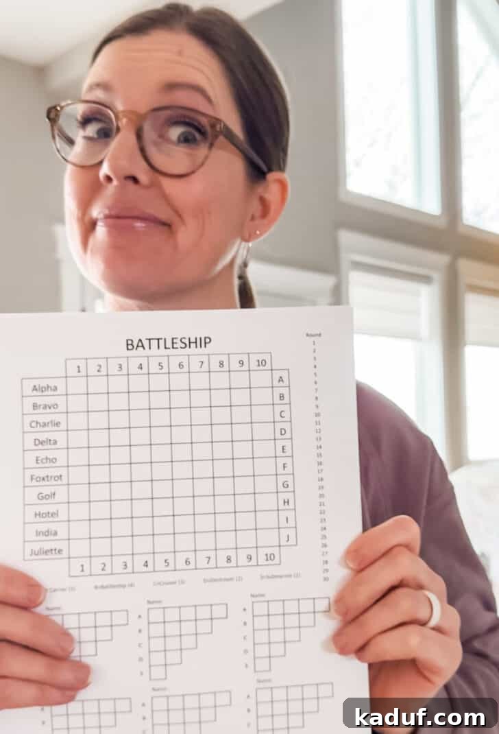 Pencil & Paper Armada 2 Woman holding paper battleship game.
