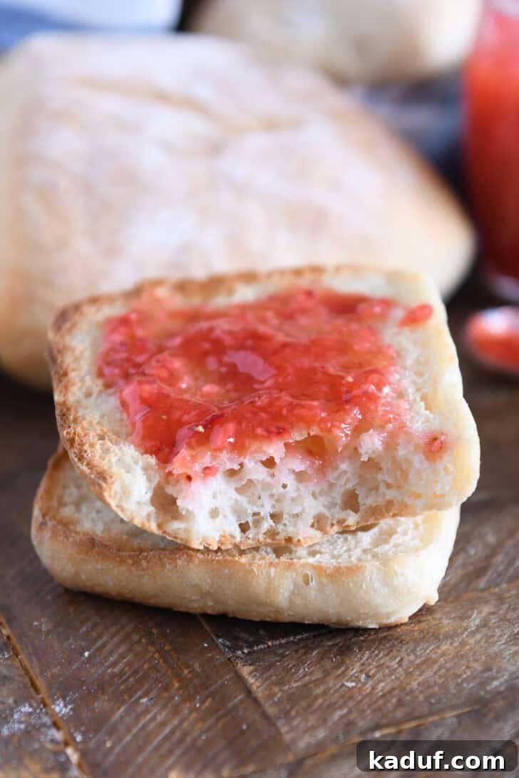Fresh Ciabatta Rolls Made Today 14 One half of ciabatta roll toasted and spread with butter and jam.