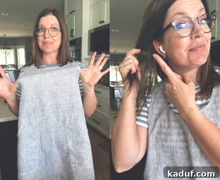 500+ Must Listen Audiobooks 2 Woman in apron in kitchen pointing to earbuds in ears.