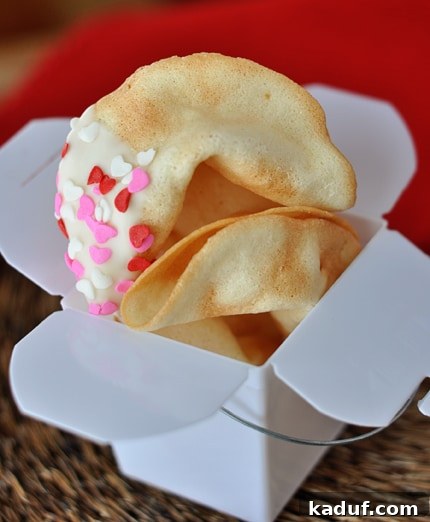 Baking Your Own Fortunes 4 A white paper container filled with freshly baked homemade fortune cookies.