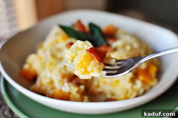 Velvety Butternut Squash Risotto 2 A beautifully plated bowl of butternut squash risotto, garnished with fresh sage and crispy bacon, ready to be enjoyed.