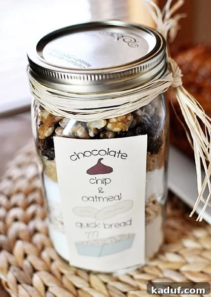 Jar Baked Oatmeal Chocolate Chip Bread 2 Mason jar with layered dried ingredients for oatmeal chocolate chip quick bread.