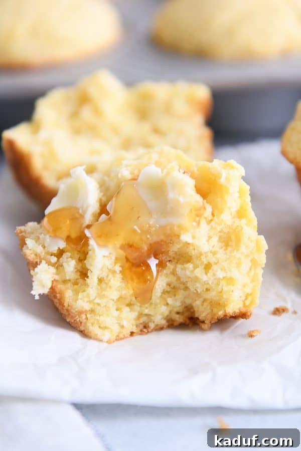 Fluffy Golden Cornbread Muffins 2 The best cornbread muffins split in half with butter and honey.