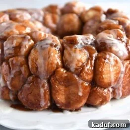 The Ultimate Sticky Pull Apart Monkey Bread 15 The finished Monkey Bread, beautifully turned out onto a white tray and glistening with a sweet glaze.