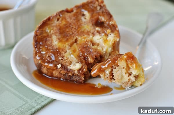 Heavenly Caramel Apple Bundt 3 Small white plate with a piece of caramel apple bundt cake with a bite taken out.