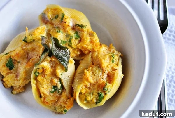 Creamy Butternut Stuffed Shells with Savory Sage Brown Butter 2 Top view of butternut squash and sage filled jumbo pasta shells, garnished elegantly, ready to serve.