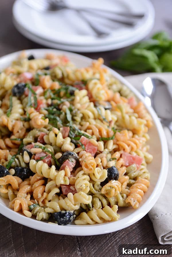 Vibrant Pasta Medley 10 A close-up of a bowl filled with vibrant tri-color pasta salad, showcasing the texture and ingredients.