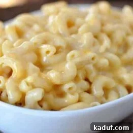 A vibrant close-up of the finished Skillet Creamy Macaroni and Cheese, ready to be served.