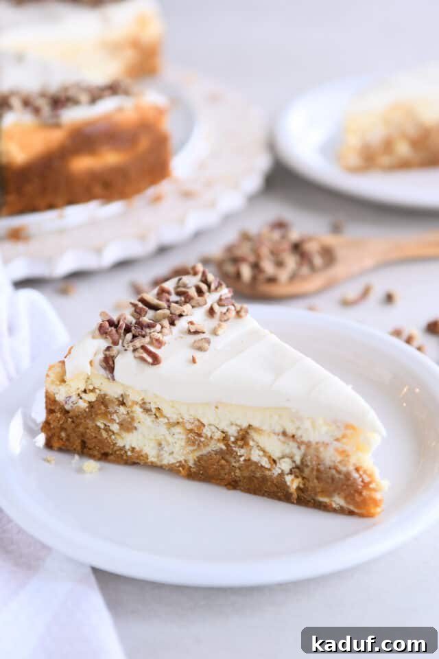 Carrot Cake Cheesecake Fusion 2 A perfectly sliced piece of carrot cake cheesecake on a pristine white plate, showcasing its distinct, creamy layers.