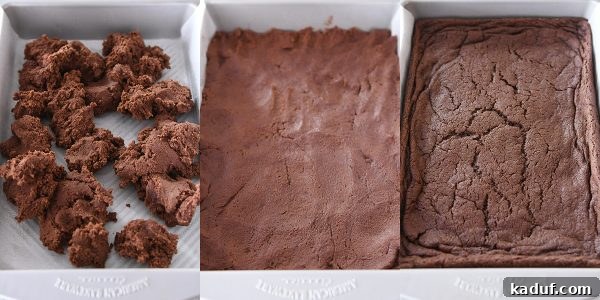 Zebra Cheesecake Brownies 6 A baker's hand pressing brownie batter into a 9x13-inch baking pan, creating an even base.