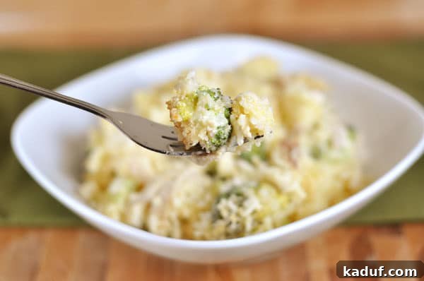 Golden Broccoli Rice Delight 3 White dish full of broccoli cheese casserole.
