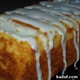 Close-up of a slice of lemon pound cake with glaze