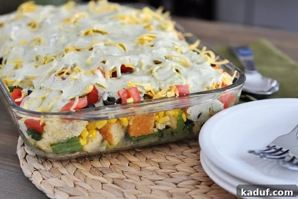 Stacked Mexican Cornbread Salad 2 A beautiful 9x13 glass dish showcasing the colorful layers of Mexican Cornbread Salad, ready to be served.