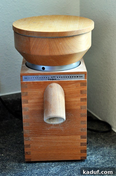 The Ultimate Guide to Wheat Grinders Plus Over 60 Popular Model Reviews 2 a Komo wheat grinder on a counter