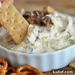 A white bowl full of peanut butter cookie dough dip.