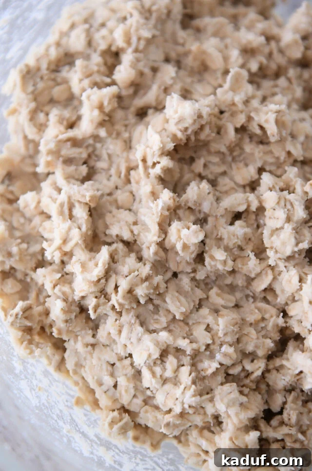 Chewy Oatmeal Lace Cookies 4 Oatmeal cookie dough in glass bowl.