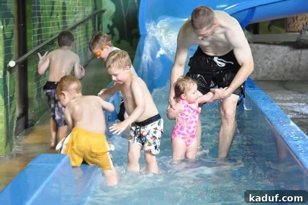 Saturday Scenes 2 Family enjoying a hotel waterslide during a birthday celebration trip to Winnipeg