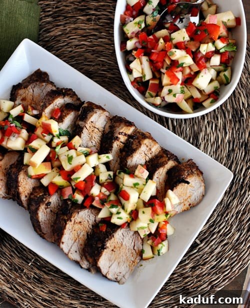 Sweet Heat Pork Tenderloin with Bright Apple Salsa 4 Top view of grilled pork loin slices with a fresh apple salsa on top.