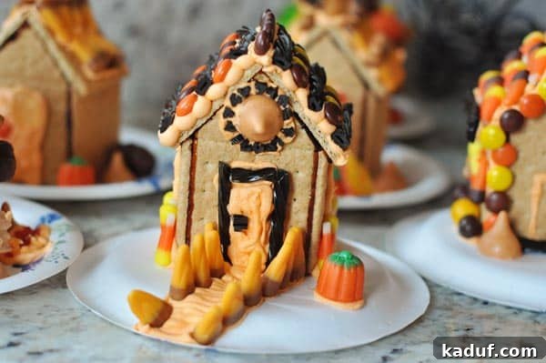 DIY Halloween Haunts 12 Collection of Halloween haunted house decorated graham cracker houses, adorned with candies and icing, ready for display