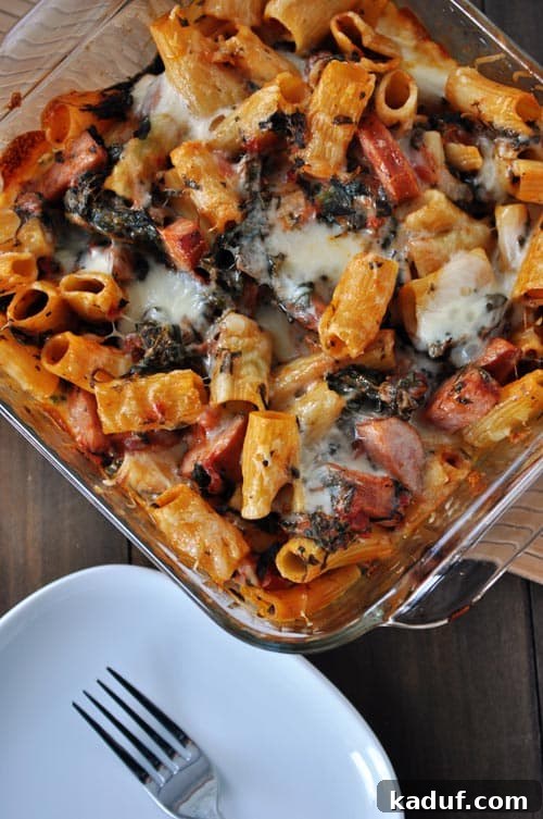 Hearty Chicken Sausage Pasta Bake 2 Casserole dish with baked pasta, cheese and chicken sausage, ready to serve.