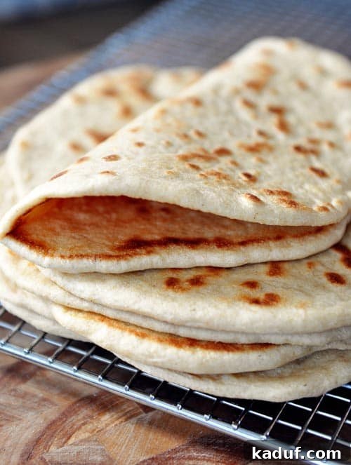 Delicious Homemade Flatbread 12 A stack of homemade flatbread cooling on a cooling rack.