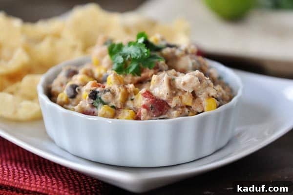 Creamy Tex-Mex Quinoa Bites 3 A white ramekin filled with a creamy corn and quinoa Tex-Mex mixture, ready to be served.
