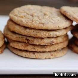Close-up of a delicious Butterfinger cookie, showing its chewy texture and candy pieces.