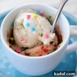 Close-up of a vanilla funfetti mug cake ready to eat.