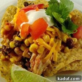 Slow Cooker Fiesta Chicken Bake 3 A top-down view of Slow Cooker Southwest Chicken Stacks with fresh toppings.