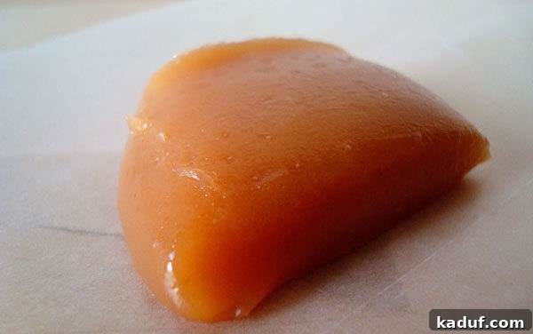 Moms Signature Caramels 3 A close-up view of a rich, light brown slab of homemade caramel before being cut.