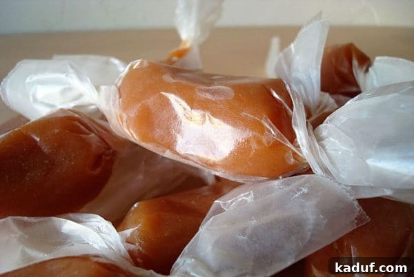 Moms Signature Caramels 5 A charming pile of individually wrapped homemade caramels, perfect for gifting.