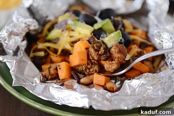 Foil Roasted Sweet Potato Tacos 3 Side view of a cooked foil packet sweet potato taco meal, showcasing its neat presentation and readiness to be opened.