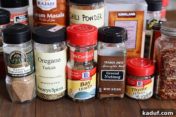 My Spice Cabinet Unveiled 6 An inviting assortment of baking spices arranged on a kitchen countertop, ready for use.