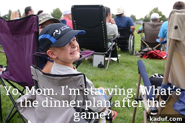 Dinner Dilemmas: When Cooking Is Out of the Question 2 A young boy sits on a camp chair, smiling brightly at the camera.