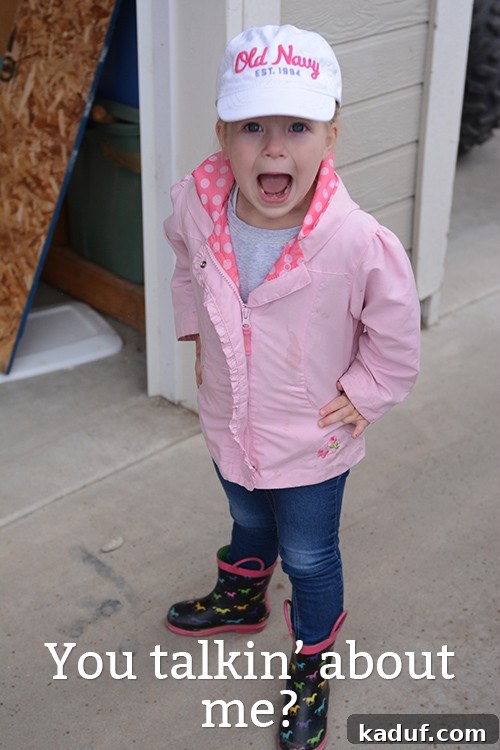 Dinner Dilemmas: When Cooking Is Out of the Question 3 A little girl in a pink jacket and white hat gazes thoughtfully.