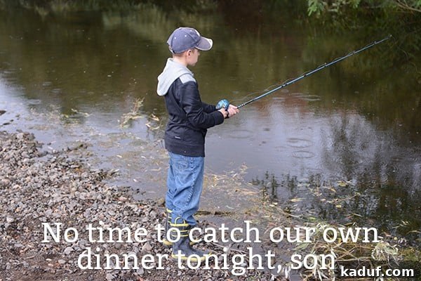 Dinner Dilemmas: When Cooking Is Out of the Question 4 A young boy fishing in a tranquil creek, enjoying the outdoors.