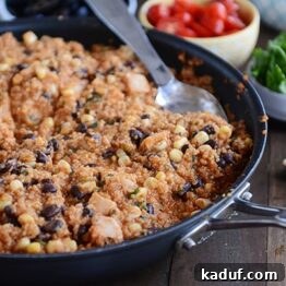 A close-up shot of the 30-Minute Quinoa Enchilada Skillet meal, showing its vibrant colors and hearty texture.