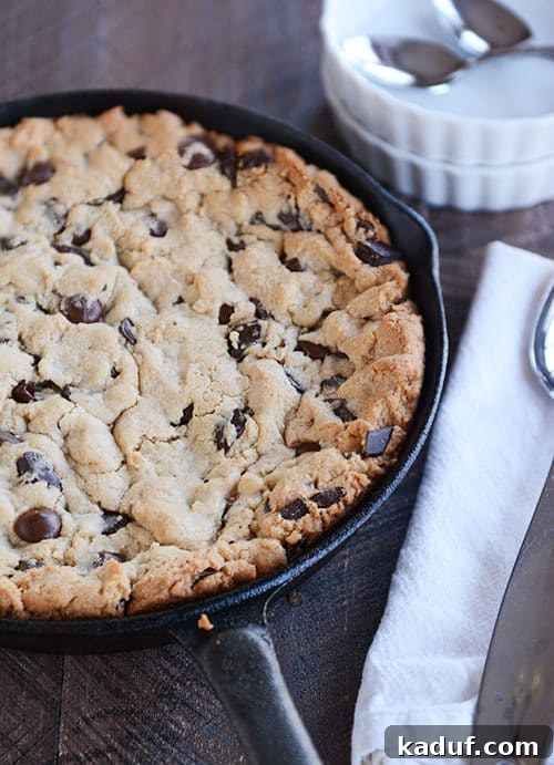 Irresistible Egg-Free Skillet Chocolate Chip Cookie 3 A chocolate chip cookie baked in a large skillet.