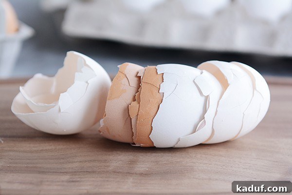 Why Egg Size Isn't Just a Number 10 Various egg shells laying on a kitchen counter, symbolizing the aftermath of successful baking.