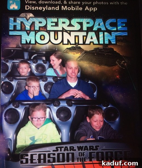 The Chill Girl's Disneyland Playbook 8 A family on a thrilling rollercoaster ride at Disneyland, all screaming with joy.