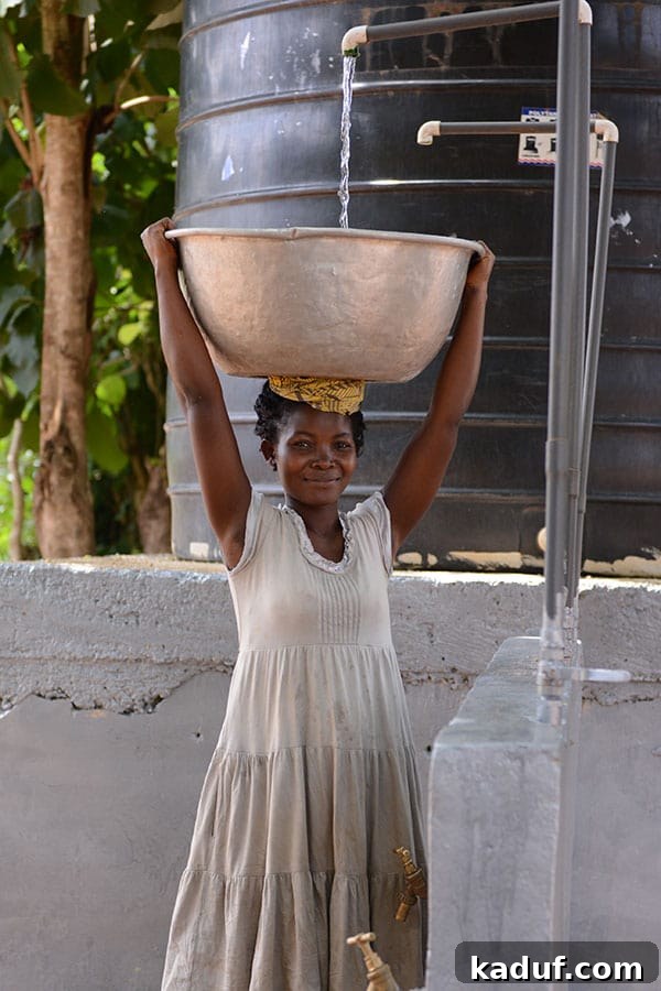 Answering Africa's Call 3 Ghanaian woman gracefully carrying water on her head
