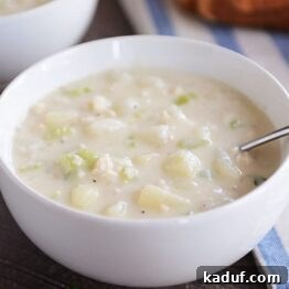 Our Signature New England Clam Chowder 6 New England Clam Chowder in a white bowl, ready to serve.