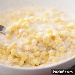 Creamy Parmesan Corn Delight 4 Delicious Parmesan Cream Corn in a white bowl.