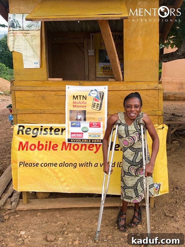 Naomi, a resilient Ghanaian entrepreneur, smiling confidently, showing the success of her mobile banking kiosk.