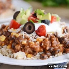 Delicious Mexican Haystacks with vibrant toppings ready to be served over rice or quinoa.